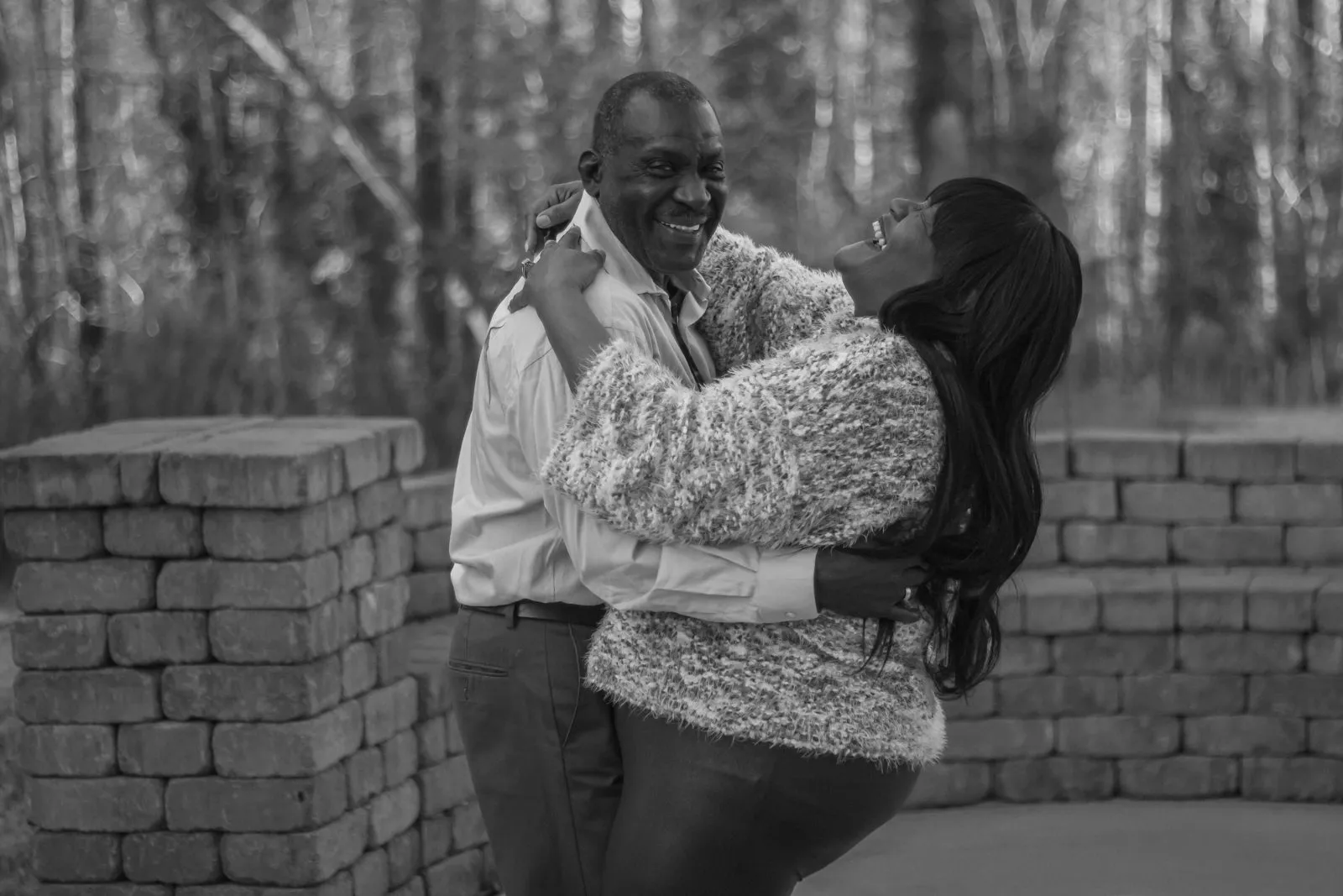 Black and white portrait of a couple embracing