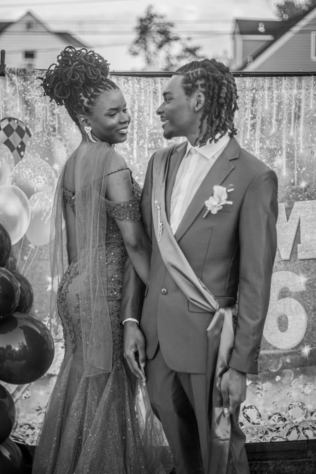 Black and white prom portrait of a couple