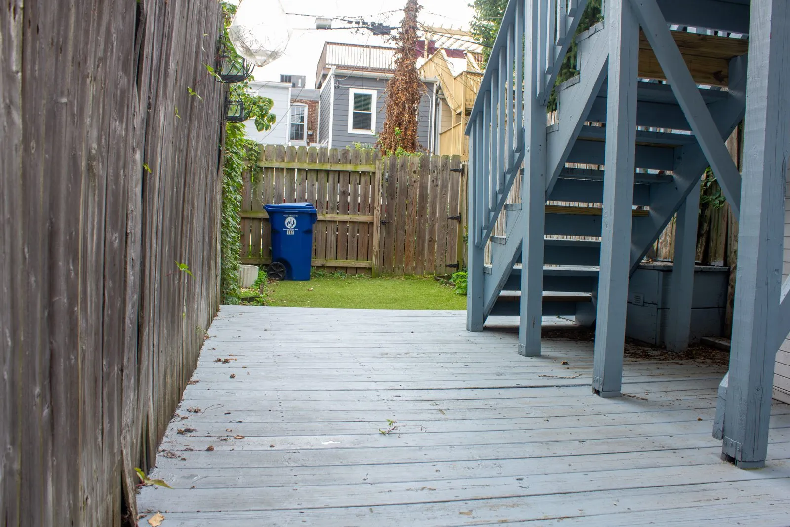 Backyard walkway and wooden stairs of a home