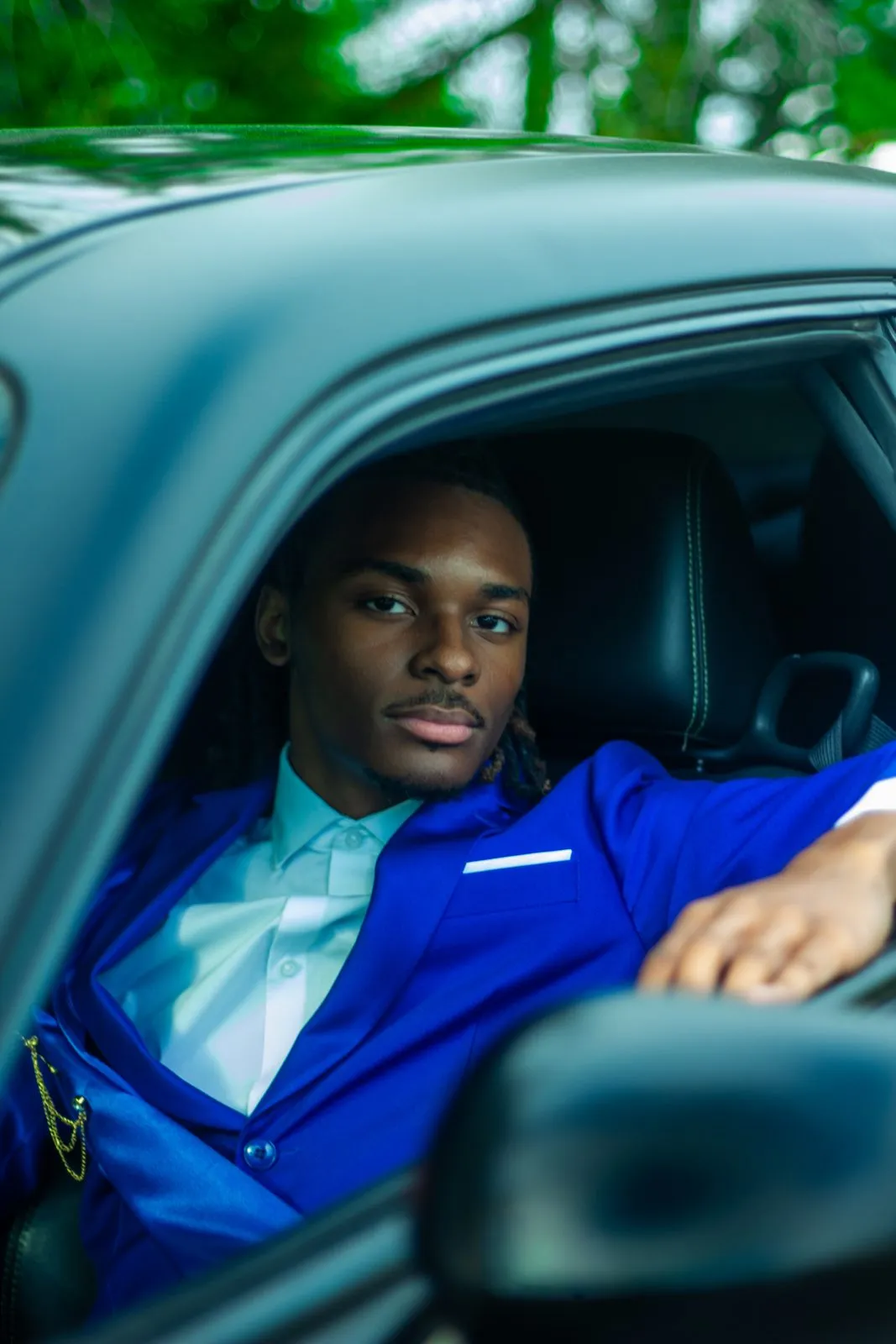 Prom portrait of a young man in a royal blue suit